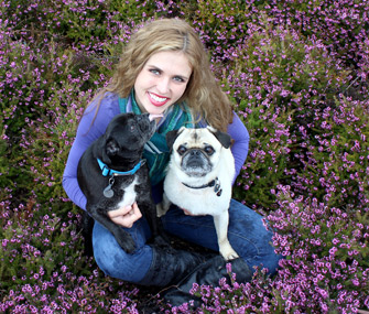 Mikkel Becker poses with her Pugs