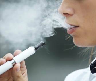 Woman smoking e-cigarette
