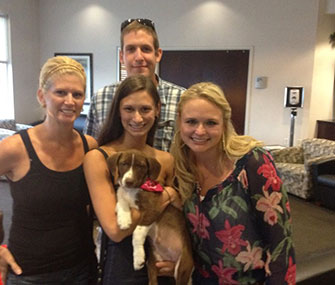 Miranda Lambert hands off the last of her foster pups to her new family.