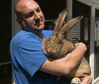 Joshua Lidsky holds his family's pet bunny, Sandy.