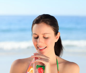 woman drinking cocktail