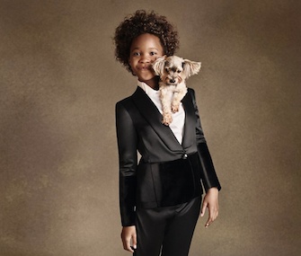 Actress Quvenzhané Wallis poses with a dog for Armani Junior.