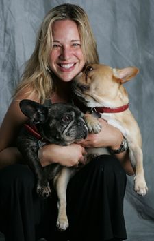 Patty Khuly holding two dogs