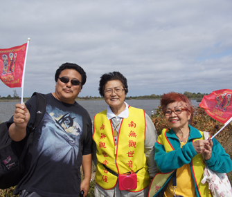 Buddhists celebrating after the release of turtles