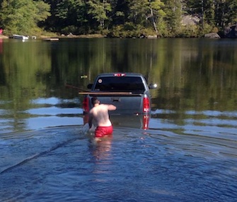 dog rescued from truck in lake