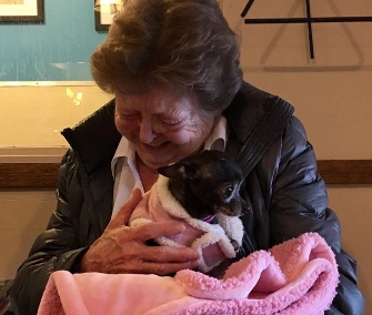 Minnie's new owner is in love with the tiny pooch.