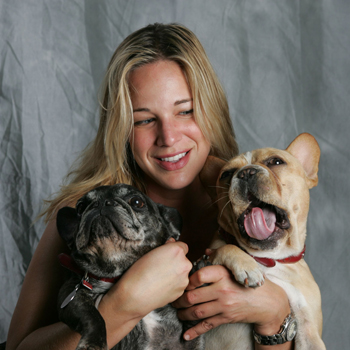 Patty Khuly Holding Two French Bulldogs