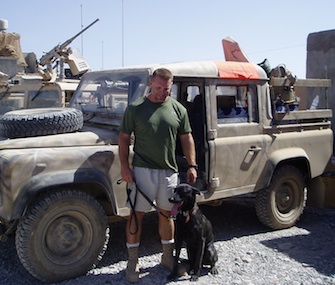 Remmy poses with Army Sgt. Dan Traeder during their time together in Afghanistan in 2004.