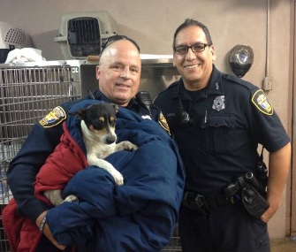 Officers Paul Garcia and Allen Speed set up a roadblock to save a stray dog on a busy highway in Fort Worth, Texas.