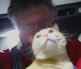 Truck driver Paul Robertson was reunited with his cat, Percy, after the cat survived 400 miles riding under the semi truck.