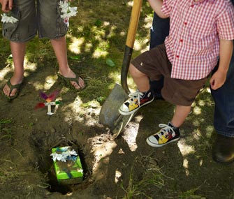 Kids burying pet