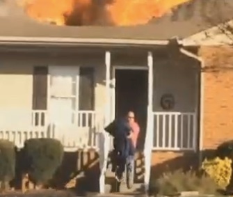 An off-duty firefighter who was passing by the scene of a fire rushed inside to save a trapped dog.