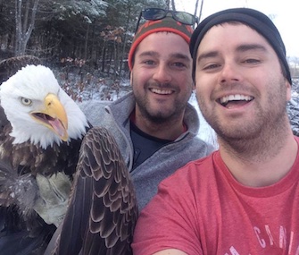 Canadian brothers Michael and Neil Fletcher took a selfie with the eagle they saved before letting it fly off.