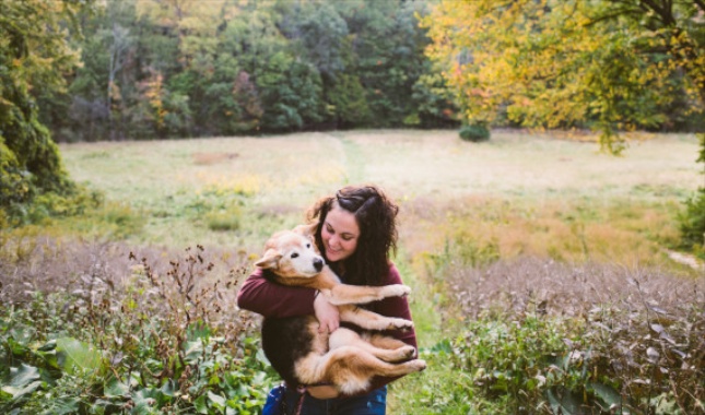 Maria Sharp holds Chubby just as she did when she was a child and the dog was a puppy.