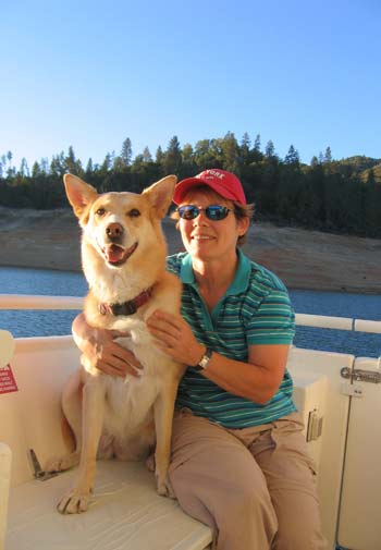 Arden Moore and dog on boat