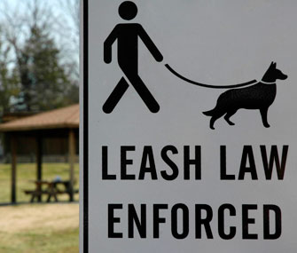 Leash law enforced sign