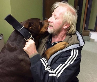 Titan smothers his original owner, Allen Williams, with kisses at their reunion Saturday.