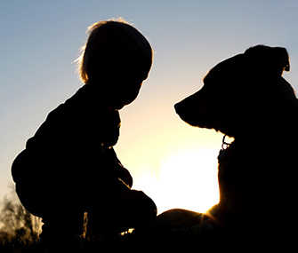 young child and dog silhouette