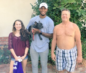 NBA player Ben McLemore poses with Mat Davis and his daughter, who helped him find his lost puppy.