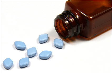 Little blue pills spilled out of bottle