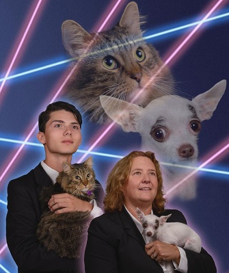 Draven Rodriguez and feline Mr. Bigglesworth pose with Principal Diane Wilkinson and her dog, Vivian.