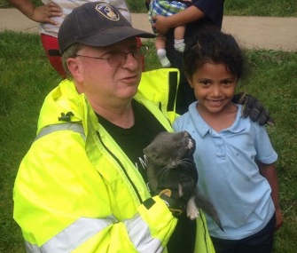 Lancaster Township Fire Department's Deputy Chief Usdin and Janeysha pose with the kitten they saved.