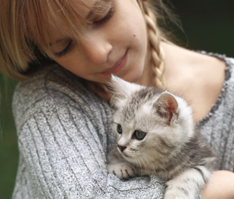 Girl petting cat