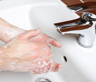Washing hands in sink