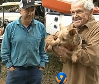 George Osterhues, right, and his dog, Tila, were rescued from their sinking car in the South Carolina floods by Tom Hall, left, and his family.
