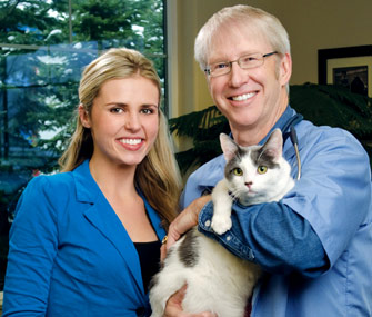 Mikkel Becker and Dr. Marty Becker with a Cat