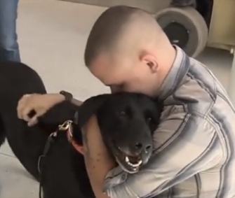 Marine Cpl. Jeff DeYoung was reunited with his partner, Cena, Thursday.