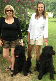 Leslie Sandlin and Barbara Conner of Swamp Dogs of LA pose with their Schnauzers Sissy and Sam