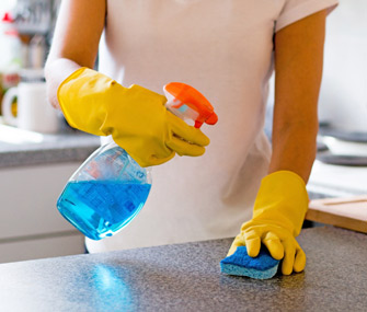 Woman spraying cleaner