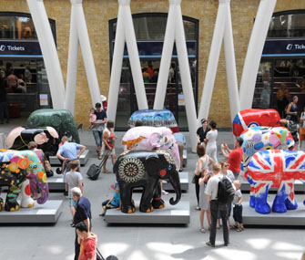 painted elephant statues on display