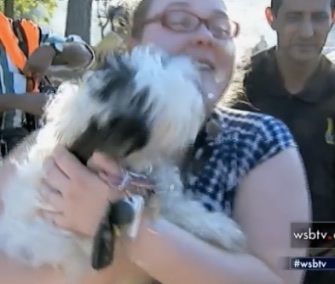 Caitlin Strischek's heartwarming reunion with her dog after a fire was caught on video.