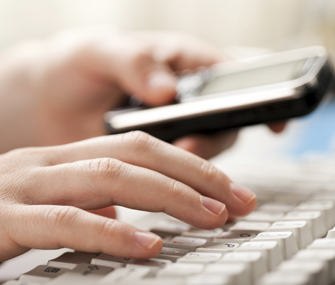 Person typing on keyboard