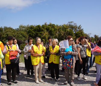 a Buddhist group gathers to release the turtles