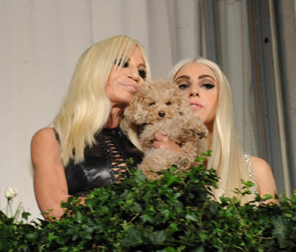 Donatella Versace and Lady Gaga pose with Fozzi Bear the Labradoodle