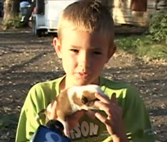 Taylor Callaway holds the puppy that was found after being dropped by a hawk.