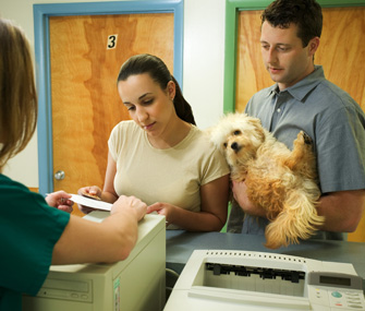 Couple at receptionist's desk