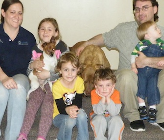 Hercules, a Pit Bull-Lab mix, and his blind friend Muellas, a Rat Terrier mix, were adopted by an Ohio family.