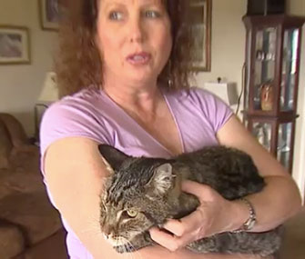 Elizabeth Corso holds her long-lost pet, Bandit.