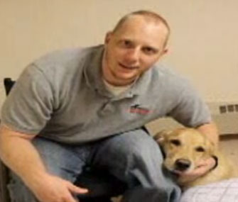 Navy veteran Joseph Worley with his service dog, Benjamin.